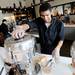 Glass Box Coffee and Juice barista Roman Martinez makes a juice for a customer during the grand opening of Arbor Hills on Thursday, August 22, 2013. Melanie Maxwell | AnnArbor.com